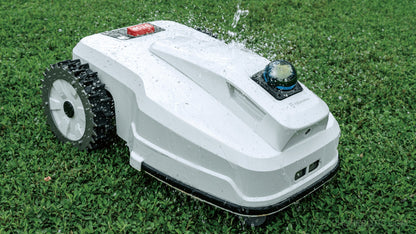 FJD FL3000 No Wire LiDAR robotic lawn mower from FJDynamics, showing the sleek design and cutting blades in action.